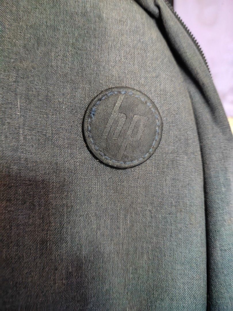 HP 15.6 inch Laptop Backpack (Category: Backpacks) located in Caloocan City. Submitted by MovesLikeJeager (Listing ID 1430067097, Image 2). Description: HP backpack is designed for 15.6-inch laptops. It features a gray exterior with the HP logo. The backpack has a main compartment and a front pocket. The dimensions are 310mm x 100mm x 445mm (12.2in x 3.94in x 17.52in), and it weighs 0.465kg (1.02lb)..