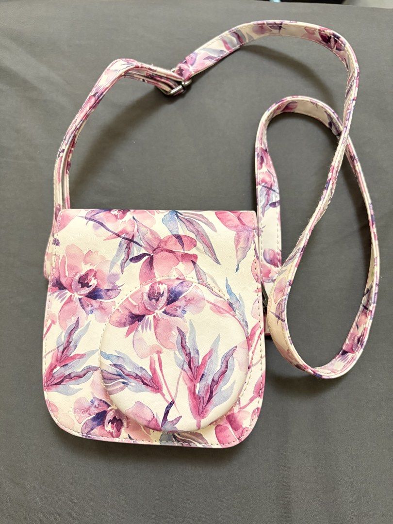 Instax Mini 8 Floral Camera Case with Strap (Category: Camera Bags & Carriers) located in Makati City. Submitted by rinadeclutters (Listing ID 1430138730, Image 1). Description: 💌 Please message before buying! - no brand - fits an Instax mini 8 camera - pink and purple floral pattern - has some stains 💰 MOP: GCash or bank transfer 📦 Shipping fee will be shouldered by buyer.