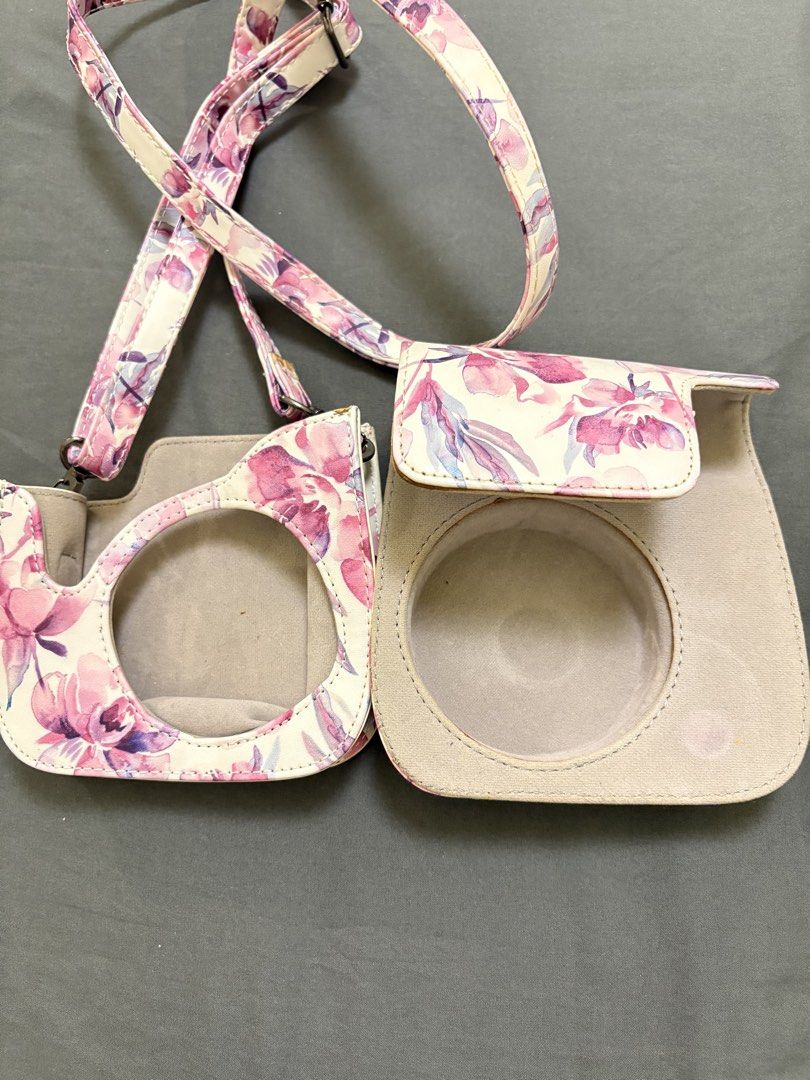 Instax Mini 8 Floral Camera Case with Strap (Category: Camera Bags & Carriers) located in Makati City. Submitted by rinadeclutters (Listing ID 1430138730, Image 3). Description: 💌 Please message before buying! - no brand - fits an Instax mini 8 camera - pink and purple floral pattern - has some stains 💰 MOP: GCash or bank transfer 📦 Shipping fee will be shouldered by buyer.