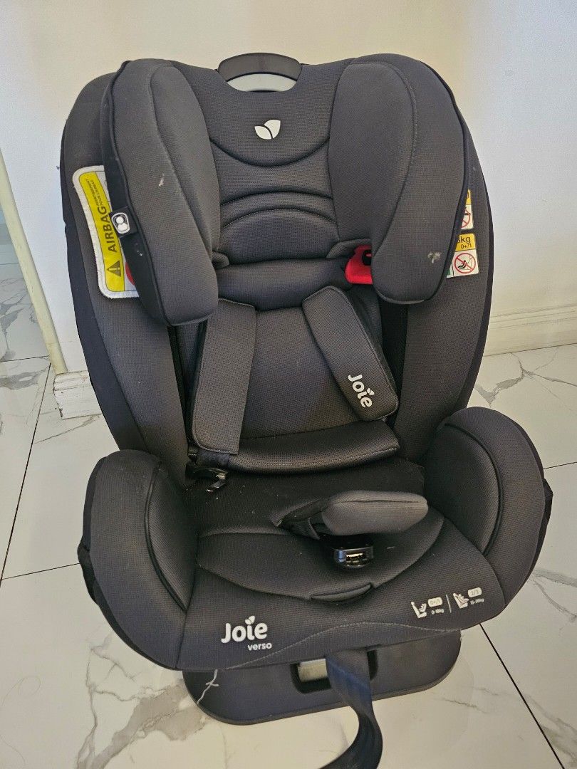 Joie Verso Car Seat (Category: Car Seats) located in Pasig City. Submitted by mommygogo (Listing ID 1430116333, Image 1). Description: Joie Verso car seat is designed for safety and comfort. It features a dark grey color and has adjustable headrest and side impact protection. The seat has a harness system and is suitable for various age groups. It includes a headrest and side impact protection. The seat is designed to provide a secure and comfort