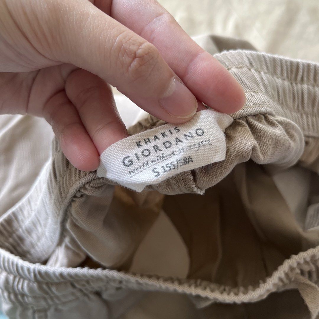 Khakis Giordano Pants - Size S (Category: Jeans) located in San Juan City. Submitted by 1104basics (Listing ID 1430069846, Image 2). Description: Khaki-colored pants from Giordano. Features an elastic waistband with a drawstring. Size S. Waist measures approximately 13 inches unstretched and 19 inches stretched. Inseam is approximately 35 inches. Has two front pockets. .