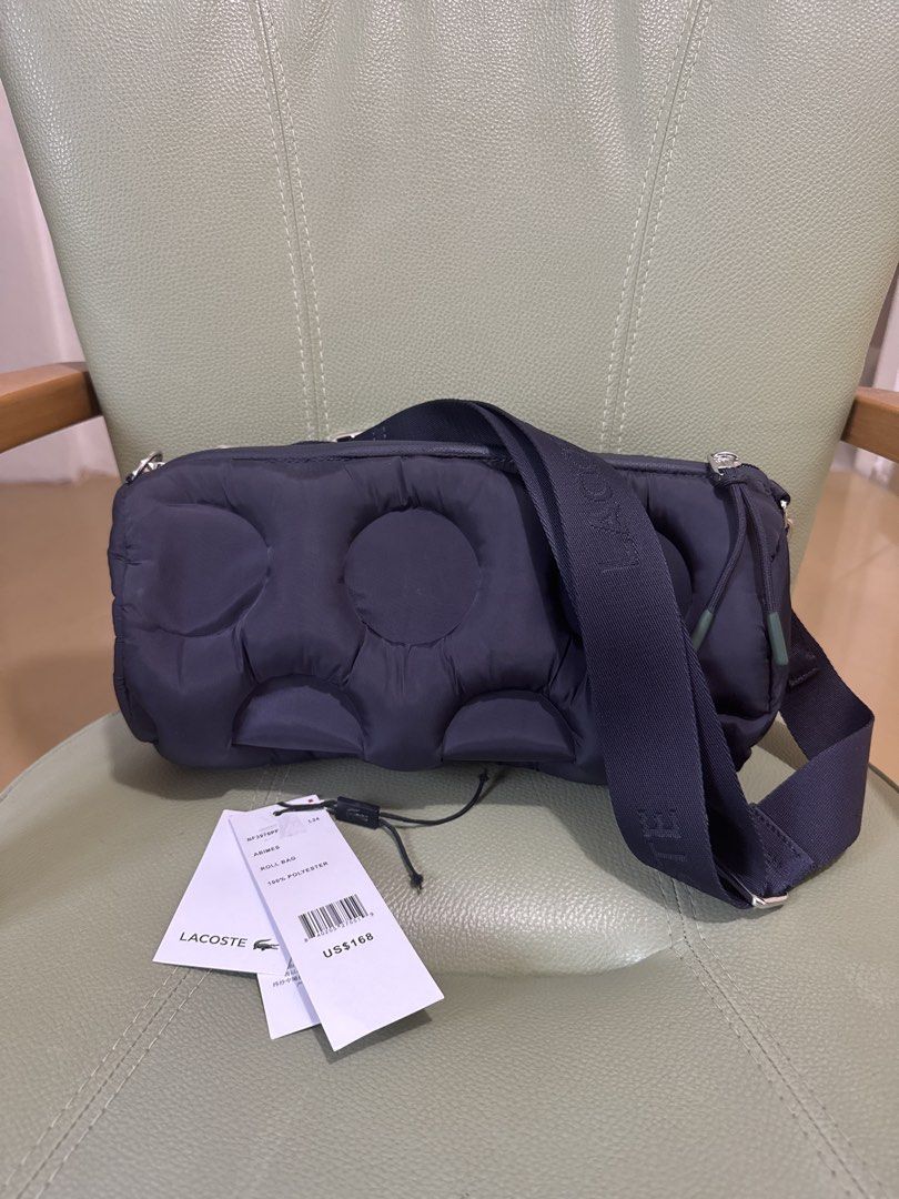 Lacoste Roll Bag (Category: Cross-body Bags) located in Los Banos. Submitted by declutterbycee (Listing ID 1430111130, Image 1). Description: Color is navy blue in actual .