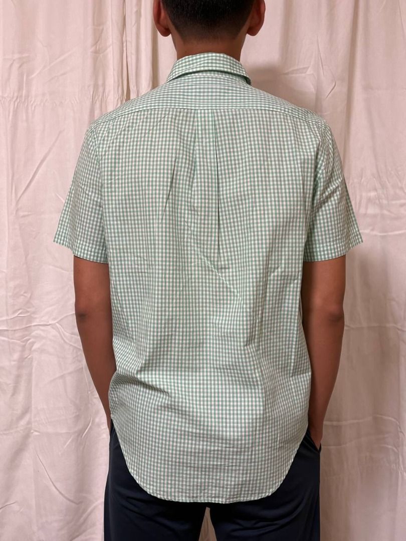 Original Lacoste Short Sleeved Gingham Print Shirt (Category: Tshirts & Polo Shirts ) located in Manila. Submitted by CaraSui (Listing ID 1430187570, Image 2). Description: Original Lacoste Short Sleeved Gingham Print Shirt Fabric: Light Poplin Color: Green Design: Gingham Striped Collar: Button-down Pocket: One pocket Fit: Regular Size: Small/Medium Chest Width: 40 (est) Length: 20 inches (est) The original price similar is at Php 3,750.00..