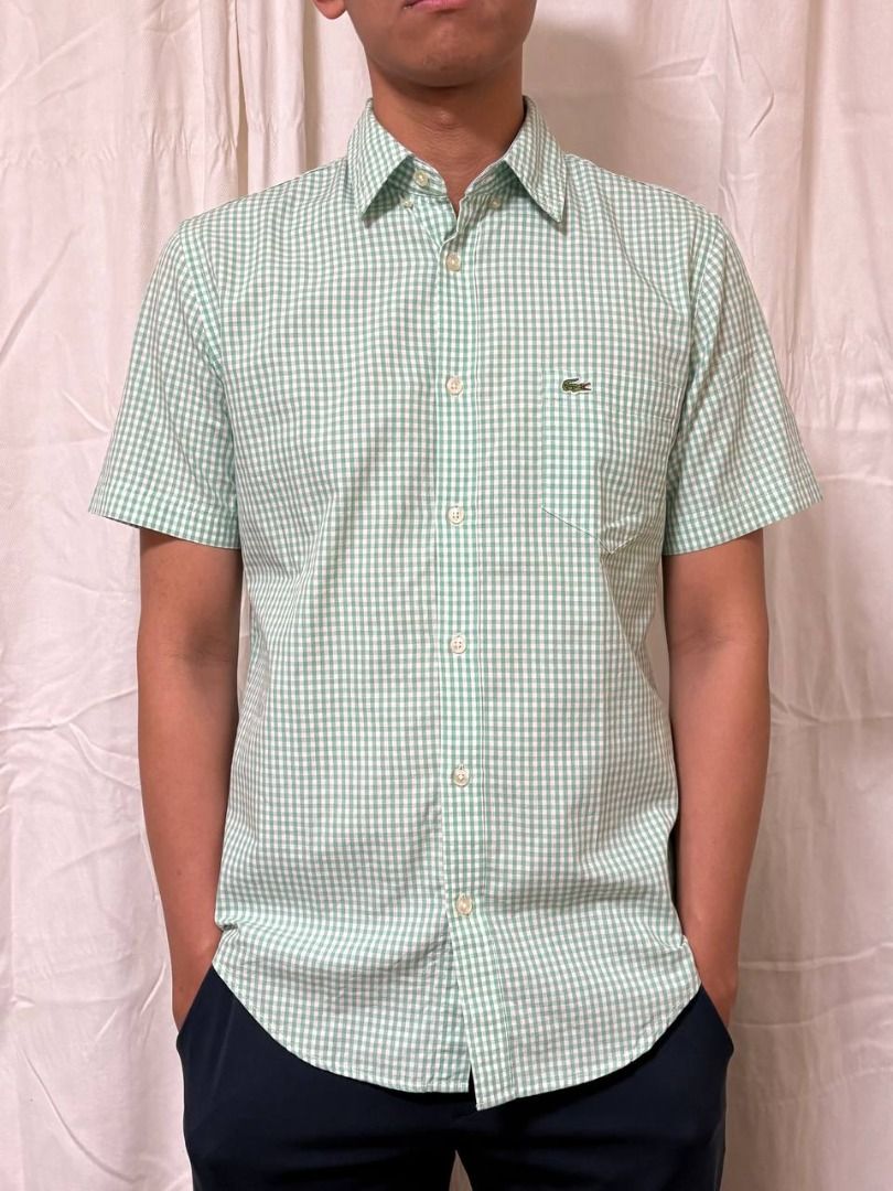 Original Lacoste Short Sleeved Gingham Print Shirt (Category: Tshirts & Polo Shirts ) located in Manila. Submitted by CaraSui (Listing ID 1430187570, Image 1). Description: Original Lacoste Short Sleeved Gingham Print Shirt Fabric: Light Poplin Color: Green Design: Gingham Striped Collar: Button-down Pocket: One pocket Fit: Regular Size: Small/Medium Chest Width: 40 (est) Length: 20 inches (est) The original price similar is at Php 3,750.00..