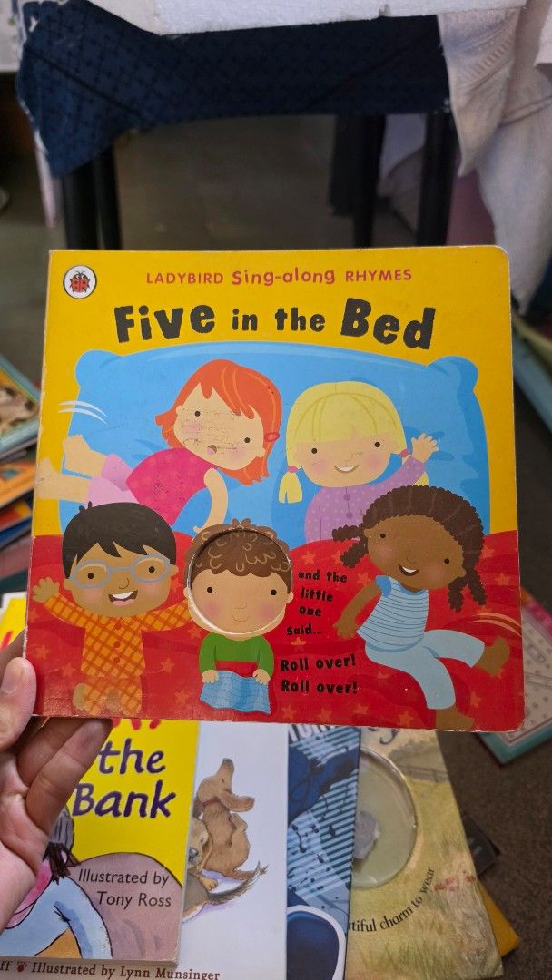 Ladybird Five in the Bed Sing-along Rhymes (Category: Children's Books) located in Pasig City. Submitted by ayen20 (Listing ID 1430112189, Image 1). Description: Ladybird Sing-along Rhymes book titled "Five in the Bed". Features colorful illustrations of children. The book includes the rhyme "Five in the Bed" and the words "Roll over!". Perfect for young children learning to read and sing along. A fun and engaging book for bedtime stories or play