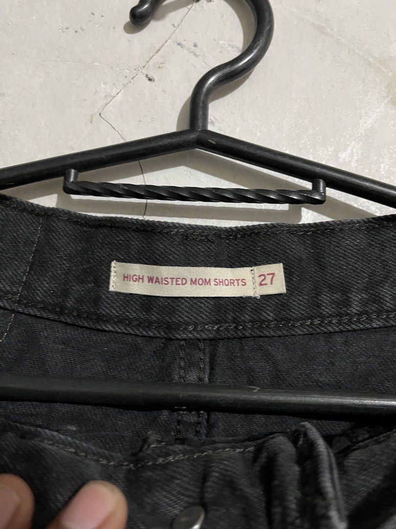 Levi's High Waisted Mom Shorts - Black (Category: Shorts) located in Santa Cruz. Submitted by thriftgane0.2 (Listing ID 1430103606, Image 3). Description: Levi's high-waisted mom shorts in black. Features a classic five-pocket design with a button and zipper closure. The shorts have the Levi's red tab on the back pocket. Size 27. Made of denim material..