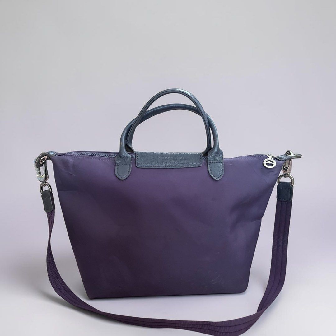 Longchamp Depose Le Pliage Handbag with Shoulder Strap (Category: Luxury Bags & Wallets) located in Pasig City. Submitted by zen_it_all (Listing ID 1430055851, Image 2). Description: - Longchamp Depose Le Pliage handbag. - Features a convenient shoulder strap. - deep purple color. - A timeless and versatile bag. - with some bubbles in the body -plus sf .