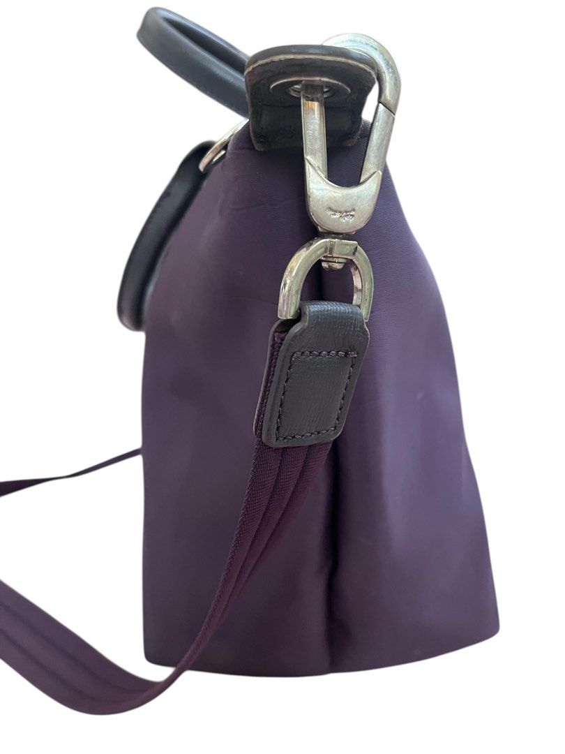 Longchamp Depose Le Pliage Handbag with Shoulder Strap (Category: Luxury Bags & Wallets) located in Pasig City. Submitted by zen_it_all (Listing ID 1430055851, Image 3). Description: - Longchamp Depose Le Pliage handbag. - Features a convenient shoulder strap. - deep purple color. - A timeless and versatile bag. - with some bubbles in the body -plus sf .
