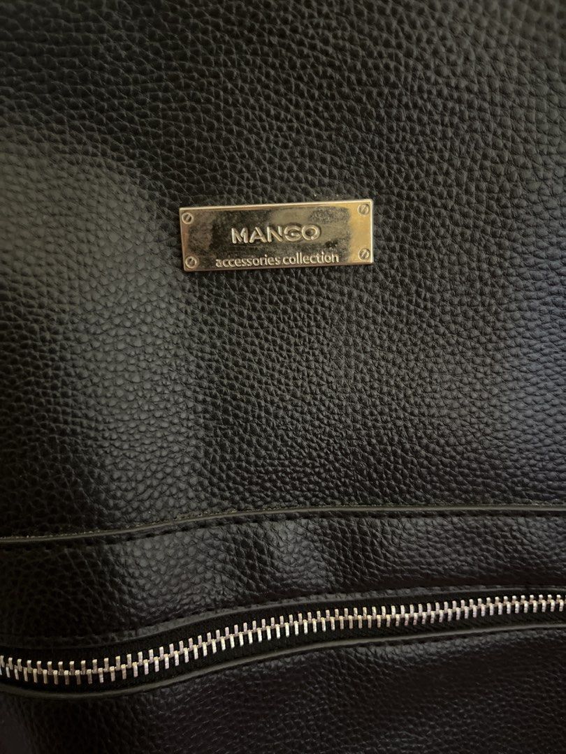 Mango Black Leather Backpack (Category: Backpacks) located in Muntinlupa City. Submitted by grace.declutters (Listing ID 1430072315, Image 2). Description: PLEASE READ - Black Mango backpack with a textured finish. - Has 1 big zippered compartment and 1 small zippered pocket - Chained (silver) and leather shoulder straps. - Has top handle The interior has a small zippered pocket as well. - can fit a 13-inch laptop but recommended for ipad and/not