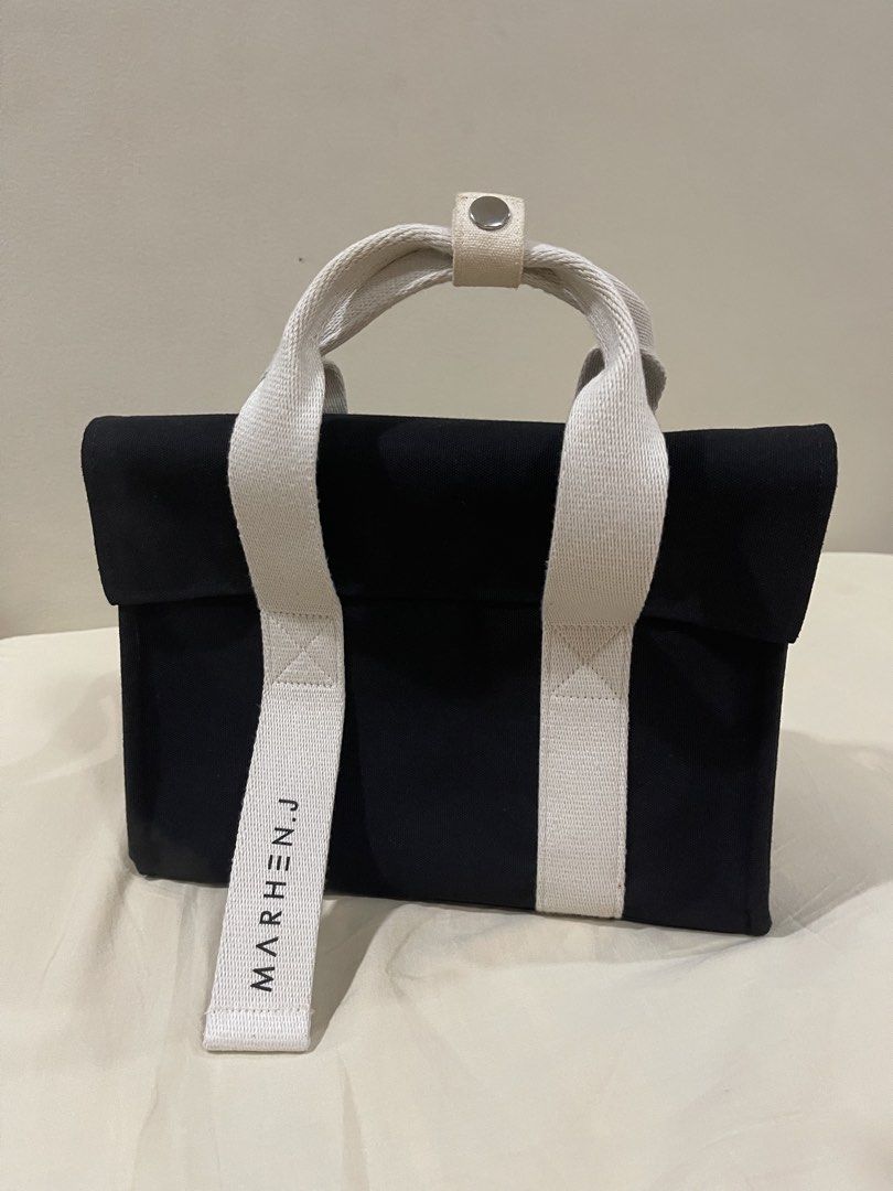 Marhen.J Rico Bag (Category: Luxury Bags & Wallets) located in Manila. Submitted by thriftea (Listing ID 1430138214, Image 2). Description: Marhen.J Rico bag features a black body with white accents and handles. It includes a detachable shoulder strap. The bag has a magnetic closure. The original packaging is included. There is a slight stain on the handle. Dimension in photo Ordered direct from Korea Extra strap (new) included - value 24 USD (fo