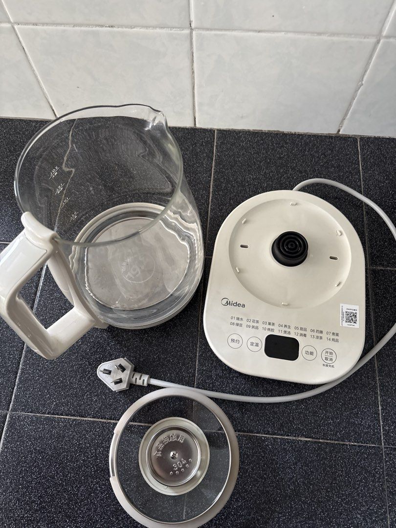 Midea Multi-Function Electric Kettle (Category: Kettles & Airpots) located in Singapore. Submitted by sknowz (Listing ID 1430071839, Image 2). Description: Lightly used. 2L negligible stain from brewing black beans. Strictly not for fussy buyer. Strictly self collect or buyer pay for postage/courier. .
