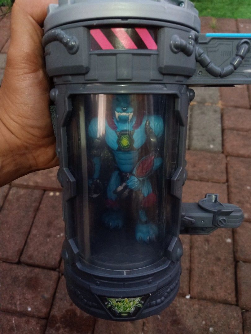 Mr beast lab mutators (Category: Action & Battle Toys) located in Las Pinas. Submitted by the_recycle_shop (Listing ID 1430130845, Image 3). Description: Mutant Mayhem action figure comes with a unique container. The figure is a blue creature with detailed armor and claws. The container is cylindrical with a clear viewing window, allowing you to see the figure inside. It has a gray and green color scheme with various mechanical details..
