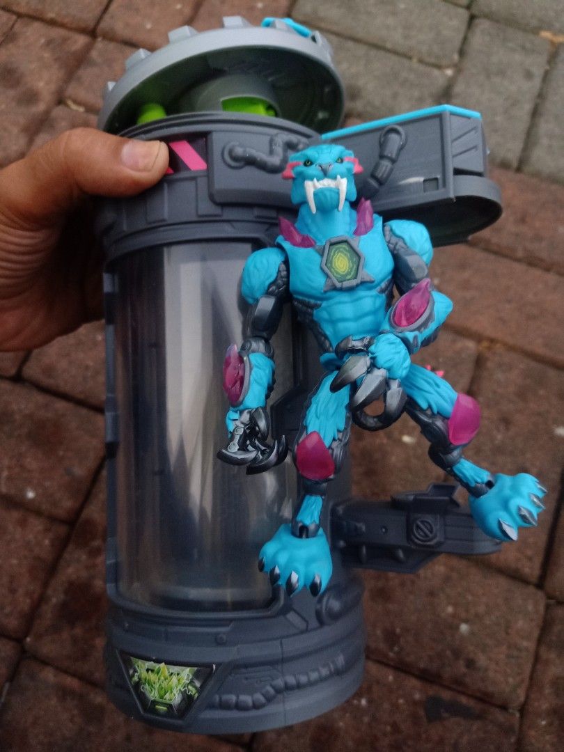 Mr beast lab mutators (Category: Action & Battle Toys) located in Las Pinas. Submitted by the_recycle_shop (Listing ID 1430130845, Image 1). Description: Mutant Mayhem action figure comes with a unique container. The figure is a blue creature with detailed armor and claws. The container is cylindrical with a clear viewing window, allowing you to see the figure inside. It has a gray and green color scheme with various mechanical details..