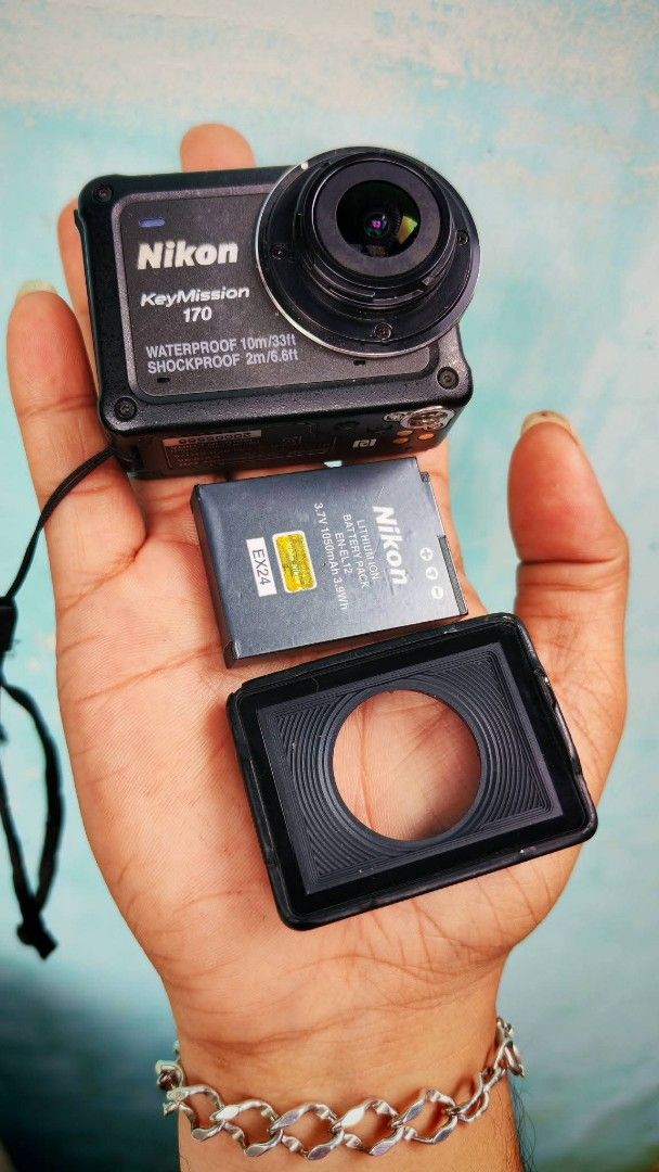 Nikon KeyMission 170 Action Camera (Category: Cameras) located in Daet. Submitted by jemotovlog28 (Listing ID 1430096526, Image 1). Description: Nikon KeyMission 170 action camera. Waterproof and shockproof. Includes a battery and a lens cover. Features a small screen and several buttons. The camera has a strap for easy carrying. The camera is black in color..
