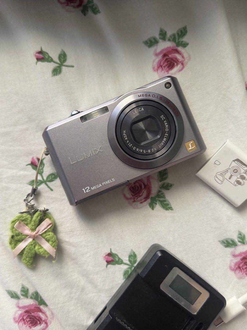 Panasonic Lumix Digital Camera/digicam (Category: Cameras) located in Manila. Submitted by cgyu._ (Listing ID 1430081717, Image 1). Description: - Panasonic Lumix digital camera - 12 megapixels - Features a Leica lens - Silver color - Includes charger and type c adaptor for easy transfer - No issues, perfectly working, flash is working.