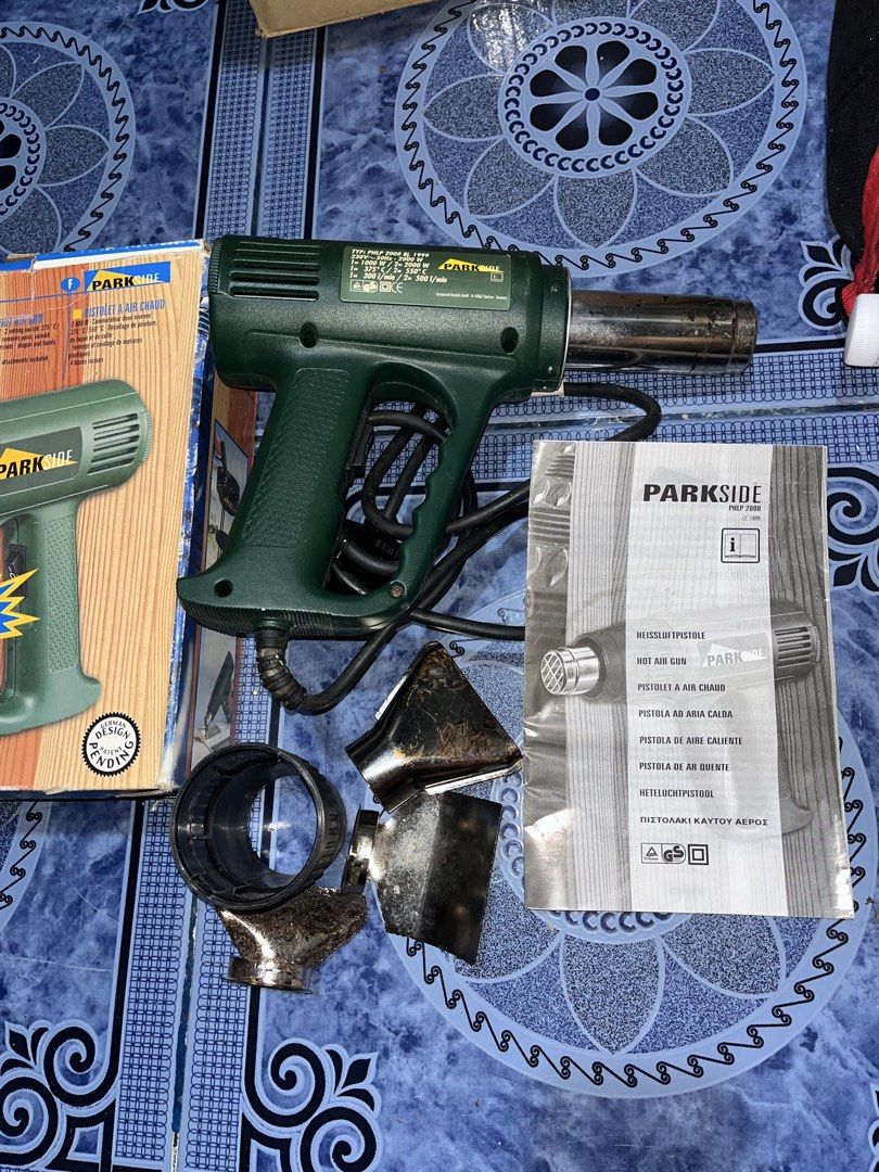 Parkside 2000W Heat Gun with Accessories (Category: Construction Tools & Equipment) located in Paombong. Submitted by sweetdeals0181656 (Listing ID 1430122078, Image 3). Description: Parkside heat gun with multiple attachments. It has a 2000W power output. Includes the original box and user manual. The heat gun has a green body and a black power cord. Several nozzle attachments are included. The model number is PHLP 2000..