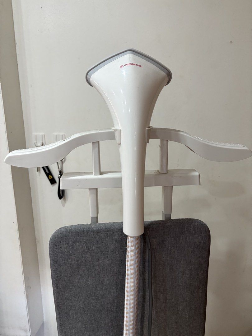 Simplus Garment Steamer (Category: Irons & Steamers) located in Manila. Submitted by trustedseller1902 (Listing ID 1430077279, Image 2). Description: Philips garment steamer is designed for easy and effective wrinkle removal. It features a built-in hanger and a fabric brush for versatile use. The steamer has a large water tank for extended steaming sessions. It is ideal for refreshing clothes and removing odors. The design includes a stable base 