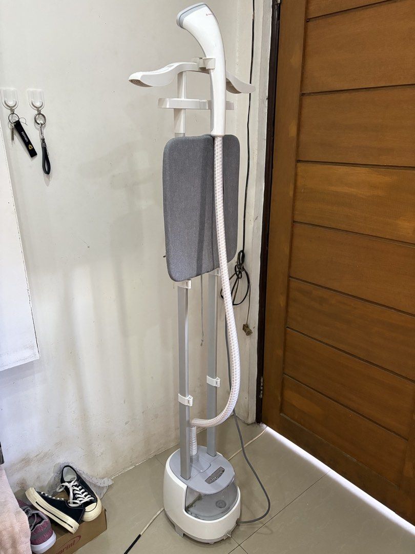 Simplus Garment Steamer (Category: Irons & Steamers) located in Manila. Submitted by trustedseller1902 (Listing ID 1430077279, Image 1). Description: Philips garment steamer is designed for easy and effective wrinkle removal. It features a built-in hanger and a fabric brush for versatile use. The steamer has a large water tank for extended steaming sessions. It is ideal for refreshing clothes and removing odors. The design includes a stable base 