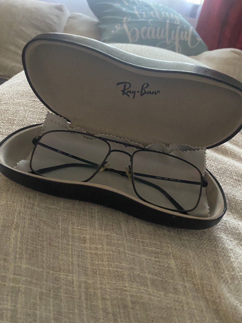 Ray-Ban RB 6434 Eyeglasses (Category: Sunglasses & Eyewear) located in San Pedro. Submitted by jamaicanorange (Listing ID 1430109305, Image 1). Description: Ray-Ban clear eyeglasses with a black frame. The model number is RB 6434. The glasses come with a Ray-Ban hard case and a cleaning cloth. The frame size is 55▢16 140. The glasses have a rectangular shape. No scratches. Light weight. RFS: decluttering and have a new eyeglasses with correct gra
