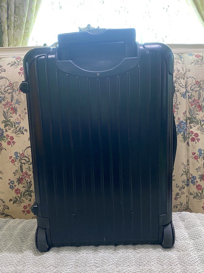 Rimowa Cabin Suitcase Black (Category: Luggage) located in Malolos. Submitted by yamaguchionline (Listing ID 1430042240, Image 2). Description: Black Rimowa cabin suitcase with a retractable handle and wheels. Features a combination lock and the Rimowa logo. The interior has a mesh divider and straps to secure belongings. Made in Germany. Includes a zipper closure and a handle on top. The suitcase has a serial number..
