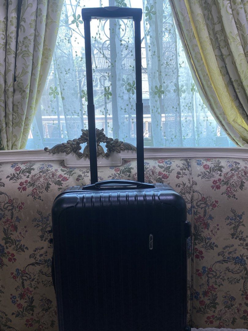 Rimowa Cabin Suitcase Black (Category: Luggage) located in Malolos. Submitted by yamaguchionline (Listing ID 1430042240, Image 1). Description: Black Rimowa cabin suitcase with a retractable handle and wheels. Features a combination lock and the Rimowa logo. The interior has a mesh divider and straps to secure belongings. Made in Germany. Includes a zipper closure and a handle on top. The suitcase has a serial number..