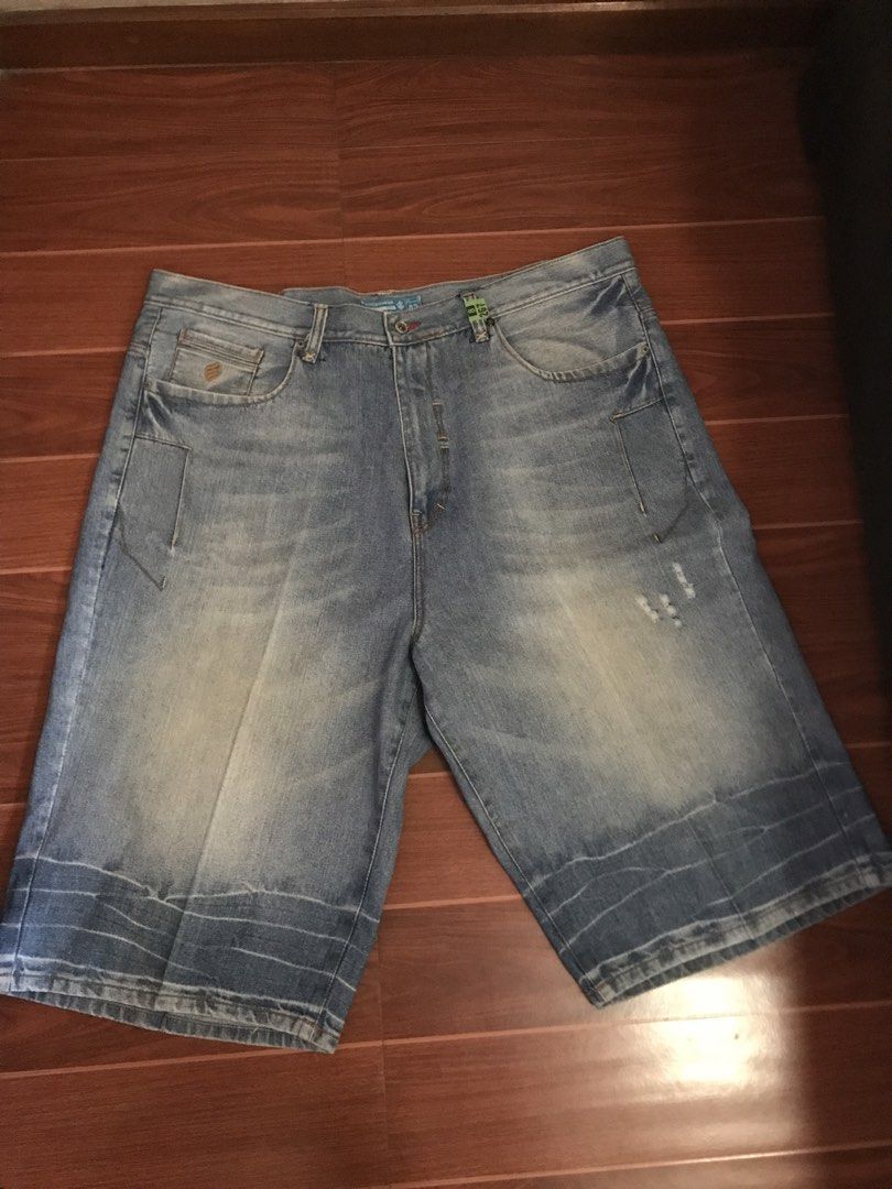 PLUS SIZE RocaWear Denim Shorts Size 42 (Category: Shorts) located in Quezon City. Submitted by lalasonlinebazaar (Listing ID 1430037486, Image 1). Description: RocaWear denim shorts in size 42. Made in Macau. Features a light blue wash with the RocaWear logo on the back pocket. The shorts have a classic five-pocket design. Made of 100% cotton. The shorts have a relaxed fit and are suitable for casual wear..