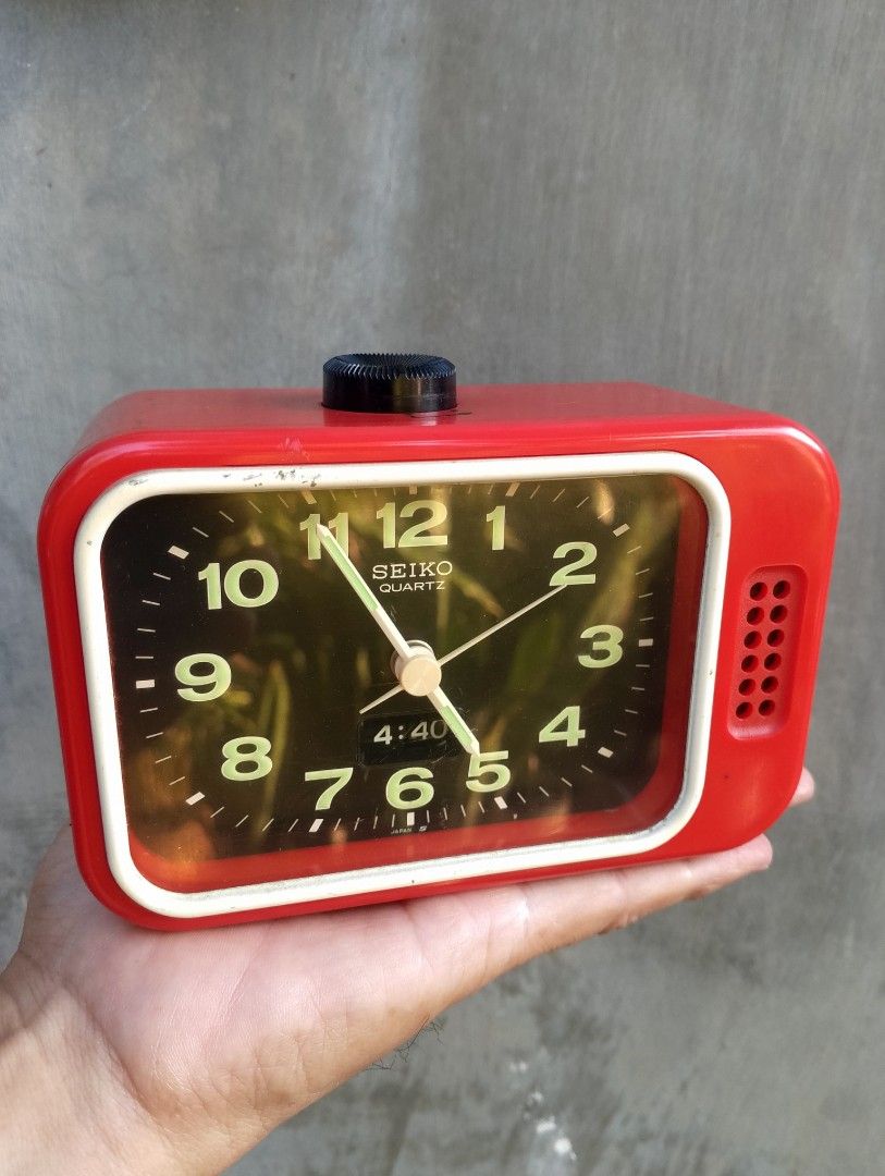 Vintage Seiko Quartz Red Alarm Clock (Category: Clocks) located in Binangonan. Submitted by stufflikedat (Listing ID 1430117743, Image 2). Description: Vintage Seiko red analog bell alarm clock, featuring a retro television design with a black dial and quartz movement, includes a quiet sweep second hand to reduce noise & features numerical alarm display & luminous hands and numerals for visibility in the dark, with a bell alarm and includes a sno