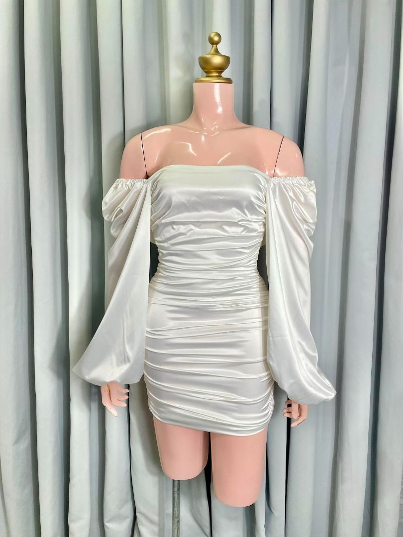 White Silk Ruched Mini Sexy Dress (Category: Dresses) located in Pasig City. Submitted by eatingstar (Listing ID 1430037376, Image 1). Description: Condition: Gently used (2x used only). Good as new, needs ironing lang para bumalik yung full kintab at ganda ng bagsak ng silk. Fabric: Premium Silk (High-quality, hindi mainit sa balat). Sleeves: Dramatic Lantern/Puff sleeves (Perfect for photos!). Fit: Stretchable body due to ruching. Fits Medium s