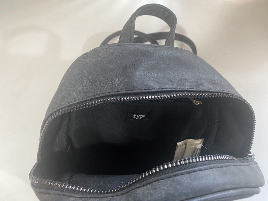 TYPO Mini Black Leather Backpack (Category: Backpacks) located in Manila. Submitted by teenagegirling (Listing ID 1430108739, Image 2). Description: ₱300 - TYPO Mini Black Backpack 📝 7/10 condition 📝 was bought in singapore 📝 slight peeling and creasing MOP - GCash MOD - Lalamove, J&T.