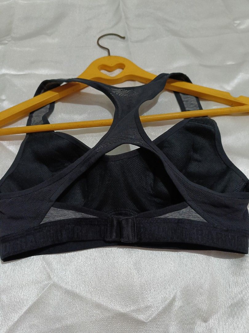 Under Armour Sports Bra (Category: Activewear) located in Bago City. Submitted by cossacloset (Listing ID 1430063692, Image 3). Description: Under Armour sports bra features a racerback design for enhanced mobility. It has a gray and black color scheme. The back has a hook-and-eye closure for an adjustable fit. Best fits xs-s. Padded. .