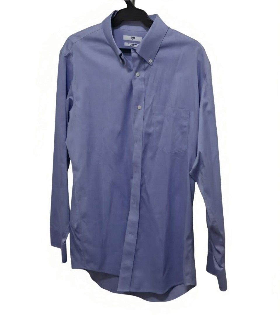 Uniqlo Blue Button-Down Shirt for the office (Category: Formal Shirts) located in Manila. Submitted by aclosetsale (Listing ID 1430142874, Image 1). Description: Light blue button-down shirt from Uniqlo. It features a button-down collar, a chest pocket, and long sleeves. It has a classic, versatile design suitable for various occasions..