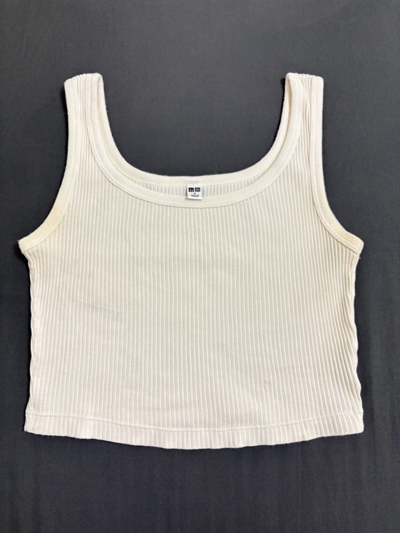 Uniqlo Ribbed White Tank Top (Category: Sleeveless) located in Makati City. Submitted by rinadeclutters (Listing ID 1430125011, Image 1). Description: 💌 Please message before buying! - brand: Uniqlo - colour: white - ribbed material - has some sweat stains (see last picture) 😅 - a bit off lint, but can be shaved off - size: small 💰 MOP: GCash or bank transfer 📦 Shipping fee will be shouldered by buyer.