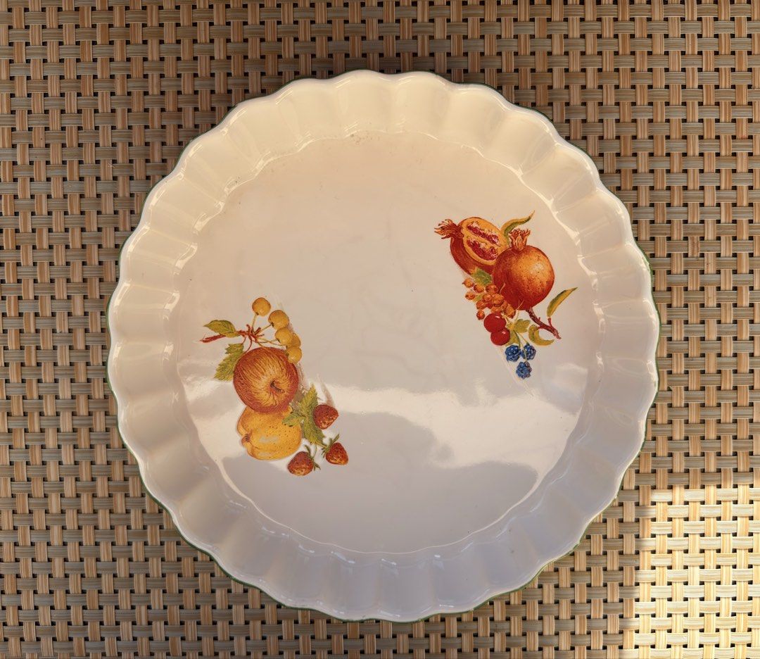 Vintage Ceramic Baking Dish with Fruit Design (Category: Bakeware) located in Bulacan. Submitted by fancy.surplusera (Listing ID 1430069370, Image 1). Description: Vintage ceramic baking dish features a lovely fruit design. It has a scalloped edge and a white finish. It's a charming addition to any kitchen and ideal for pies, tarts, or other baked goods..