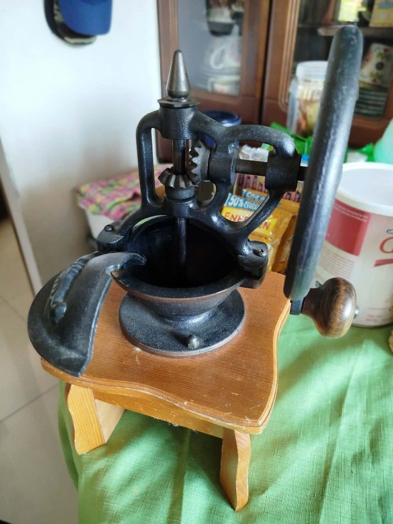 Vintage Hand Crank Coffee Grinder (Category: Coffee Machines & Makers) located in Makati City. Submitted by meowmyella (Listing ID 1430043481, Image 1). Description: Vintage hand crank coffee grinder features a cast iron body and a wooden base. It has a crank handle and a small drawer for collecting ground coffee. It's a charming addition to any kitchen or coffee enthusiast's collection. Selling for PHP 1,000 only! ‼️missing coffee dispenser BUT 