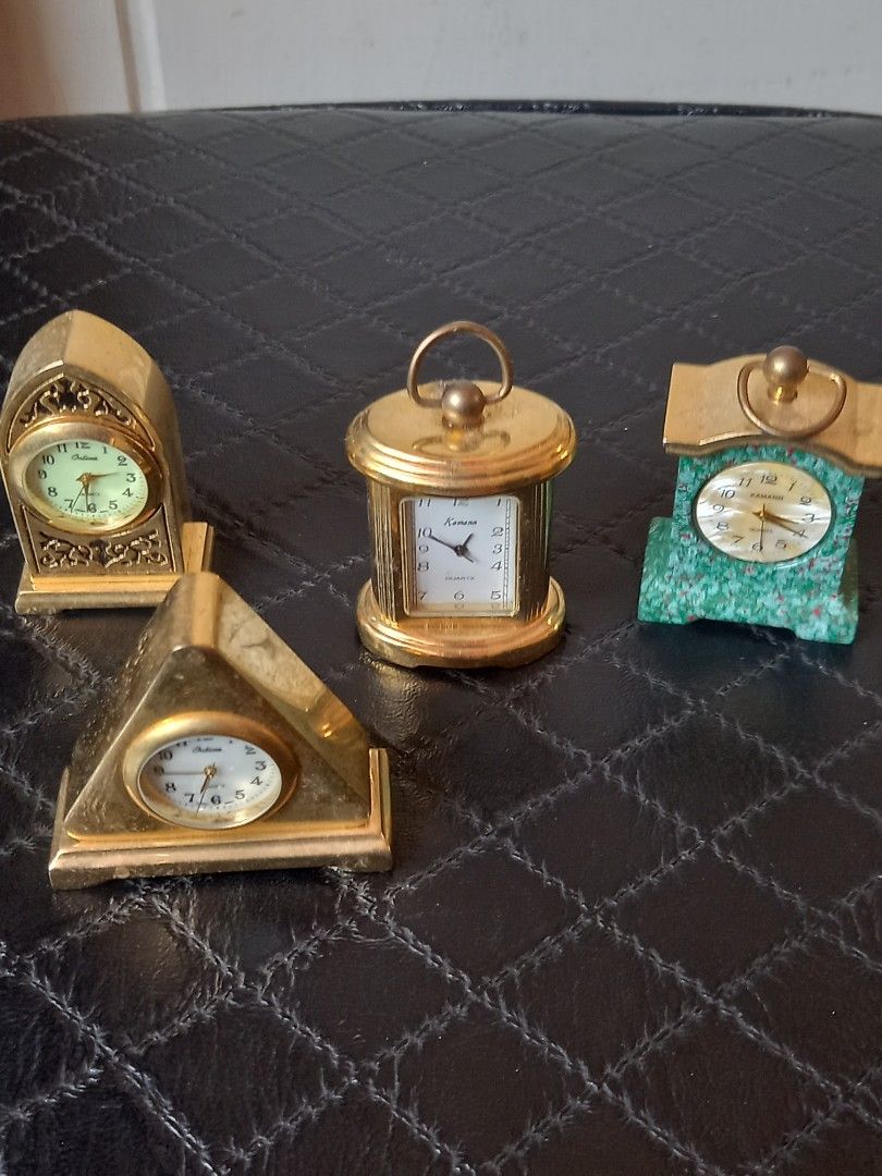 Vintage Miniature Decorative Clocks (Category: Clocks) located in Tuguegarao City. Submitted by zenphoenix-7ad615 (Listing ID 1430050361, Image 1). Description: Set of vintage miniature decorative clocks. Includes a variety of shapes and designs, such as a green stone clock, a cylindrical clock, a triangular clock, and a decorative clock. All clocks appear to be gold-toned. These clocks would be a great addition to any collection or as decorative