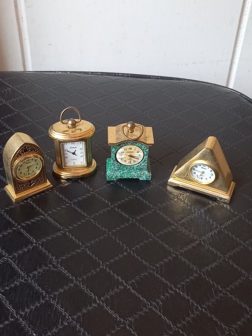Vintage Miniature Decorative Clocks (Category: Clocks) located in Tuguegarao City. Submitted by zenphoenix-7ad615 (Listing ID 1430050361, Image 3). Description: Set of vintage miniature decorative clocks. Includes a variety of shapes and designs, such as a green stone clock, a cylindrical clock, a triangular clock, and a decorative clock. All clocks appear to be gold-toned. These clocks would be a great addition to any collection or as decorative