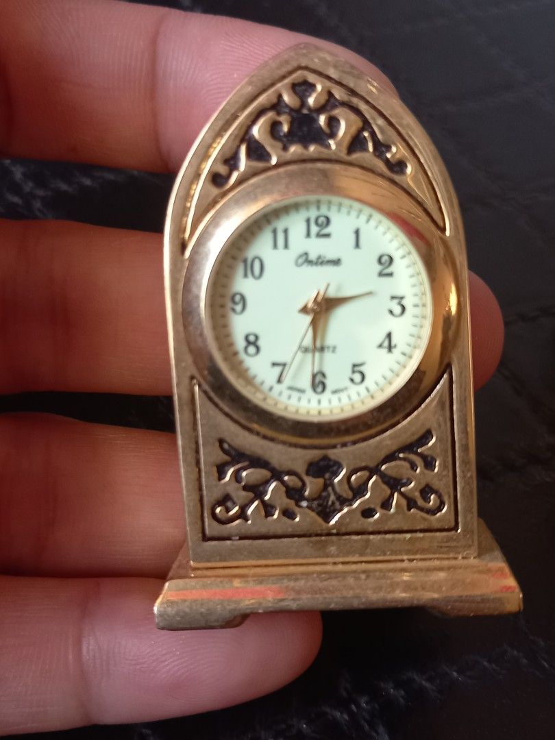 Vintage Miniature Decorative Clocks (Category: Clocks) located in Tuguegarao City. Submitted by zenphoenix-7ad615 (Listing ID 1430050361, Image 2). Description: Set of vintage miniature decorative clocks. Includes a variety of shapes and designs, such as a green stone clock, a cylindrical clock, a triangular clock, and a decorative clock. All clocks appear to be gold-toned. These clocks would be a great addition to any collection or as decorative