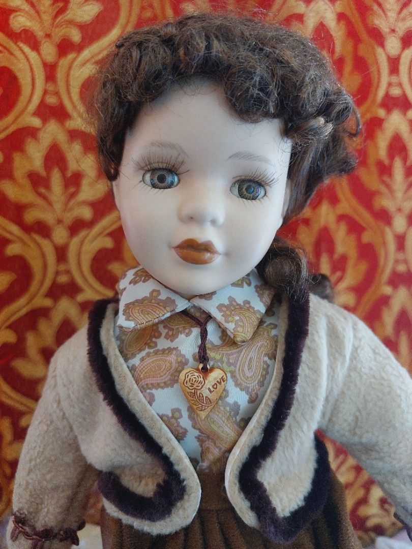 Vtg Bisque Porcelain Doll (Category: Figurines & Statues) located in Muntinlupa City. Submitted by sakurambo_des (Listing ID 1430036902, Image 3). Description: -Rare Vintage bisque porcelain doll -Glass eye,synthetic curly brown hair, multiple layered outfit. - Features a brown and cream outfit - Beautifully detailed face - Perfect for collectors. Kindly check pictures for other details..