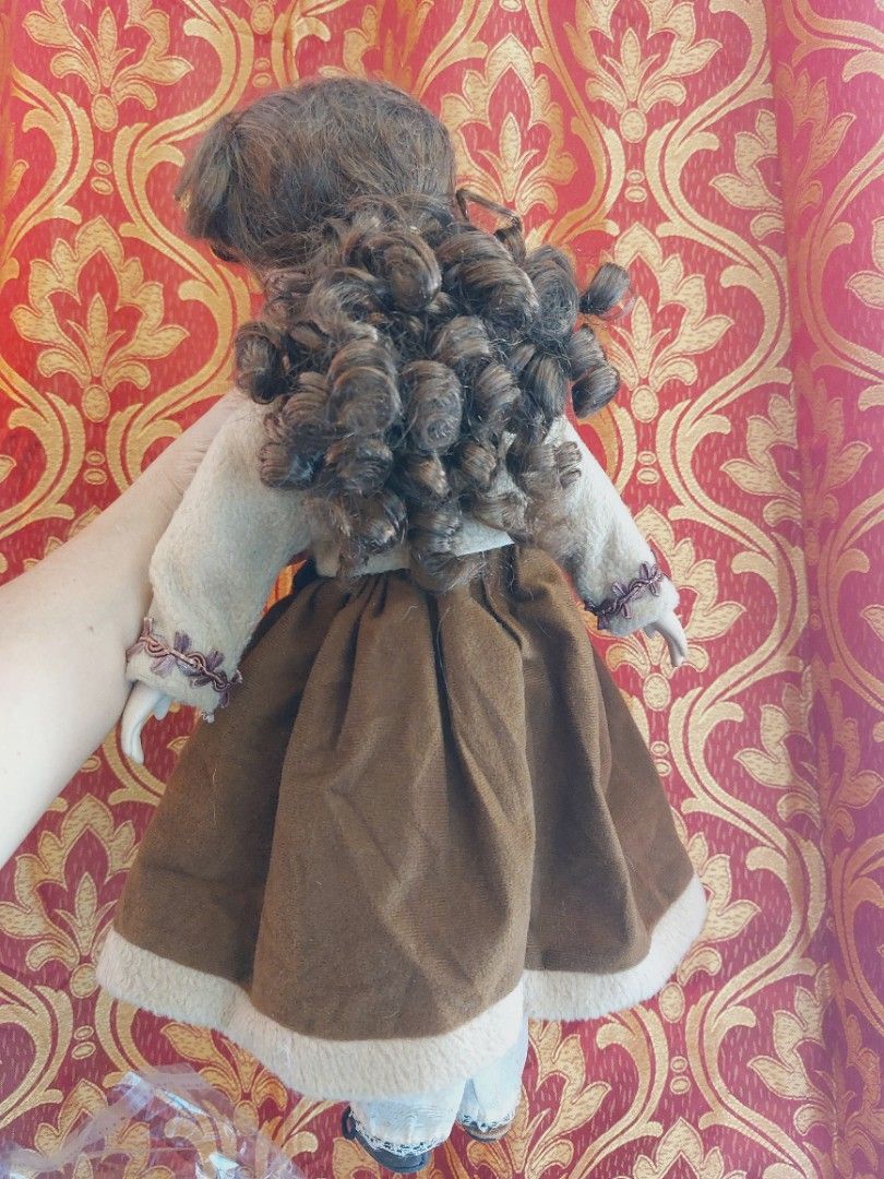 Vtg Bisque Porcelain Doll (Category: Figurines & Statues) located in Muntinlupa City. Submitted by sakurambo_des (Listing ID 1430036902, Image 2). Description: -Rare Vintage bisque porcelain doll -Glass eye,synthetic curly brown hair, multiple layered outfit. - Features a brown and cream outfit - Beautifully detailed face - Perfect for collectors. Kindly check pictures for other details..
