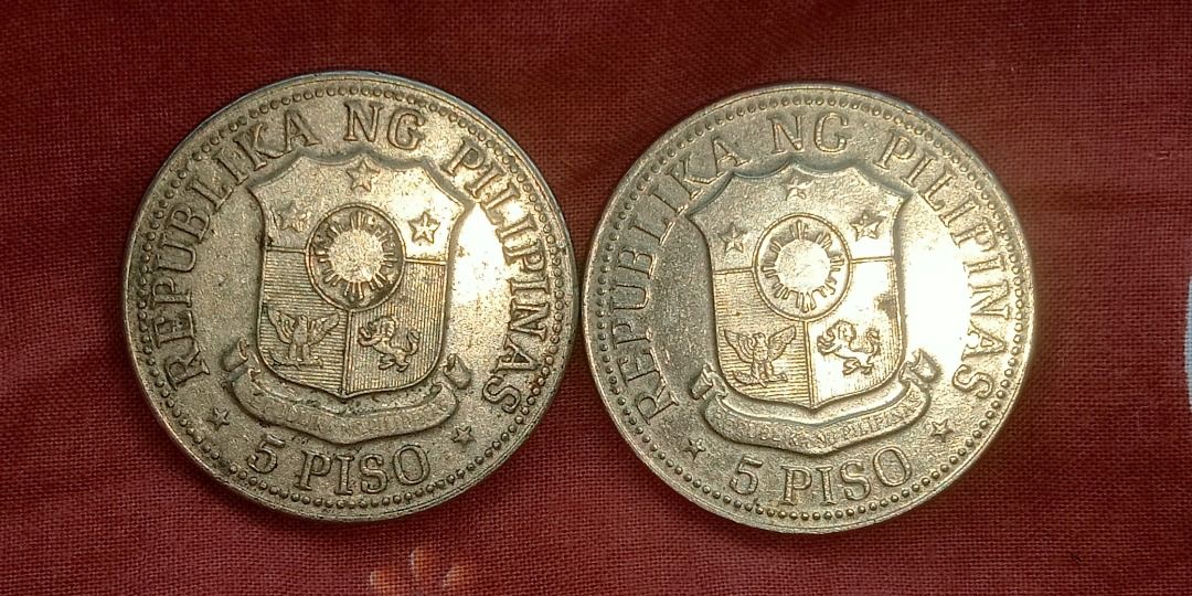 1975 5 Piso Coins (Category: Currency) located in Dasmarinas. Submitted by kyan_collections (Listing ID 1430375968, Image 2). Description: Two 1975 5 Piso coins featuring the image of a Fernidad Marcos on one side and the Philippine coat of arms on the reverse. Condition: Slightly circulated but still in good conditon Make offer if interested, policy is no to joyminer or bogus buyer, if interested po kayo, gagawa lang kayo ng offer. Di yan mahira