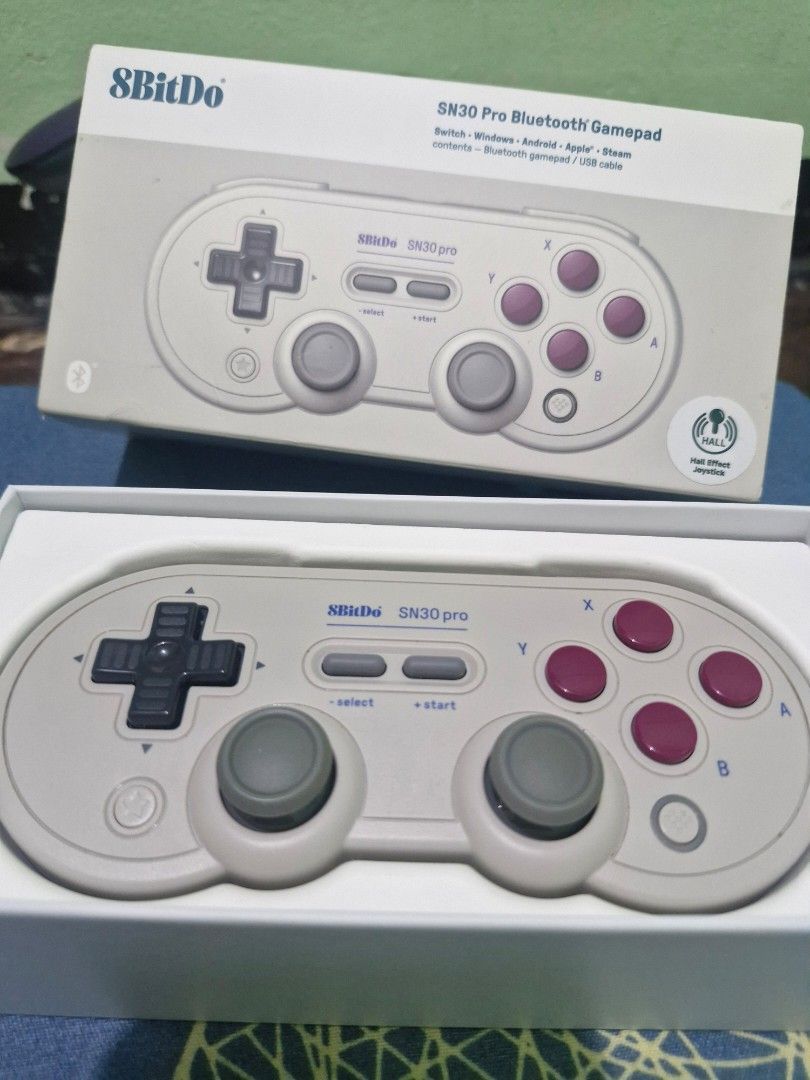 8BitDo SN30 Pro Game Controller (Category: Controllers) located in Pasig City. Submitted by rainbowbright8 (Listing ID 1430316175, Image 1). Description: 8BitDo SN30 Pro is a versatile game controller compatible with Switch, Apple, Windows, Steam, Android, and Raspberry Pi. It features a classic design with a D-pad, two analog sticks, and action buttons. The controller connects via Bluetooth. The model is SN30 Pro..