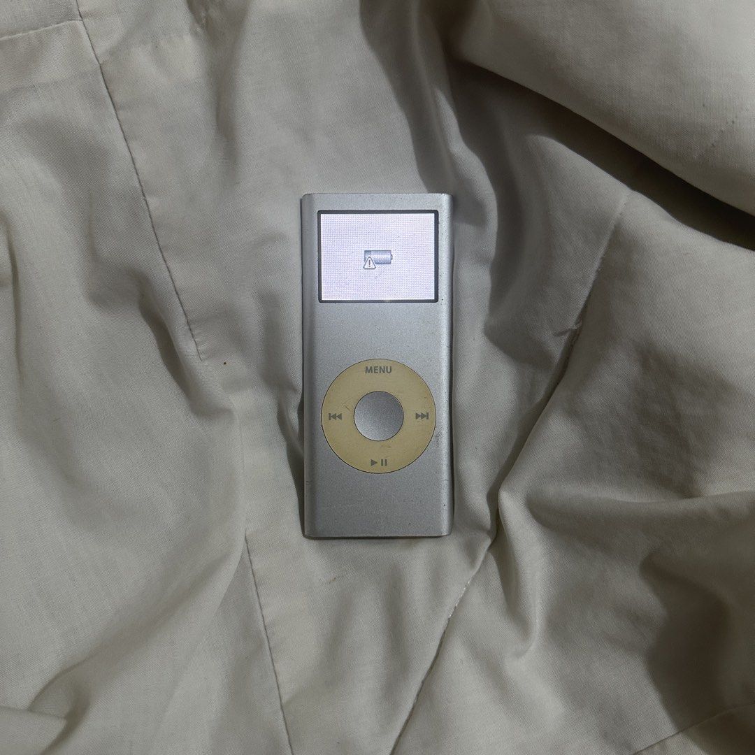 Apple iPod Nano 2nd Generation (Category: Portable Music Players) located in Mangaldan. Submitted by wonsophy (Listing ID 1430374981, Image 1). Description: - Visible scratches and yellowing buttons - Working, no functional issues - Battery still lasts, can last a few hours - 4gb, software version 1.1.3 Inclusions: - iPod Nano 2nd Gen - Charging cord (not original) MOP: Gcash Courier: J&T SF will be shouldered by the buyer Sure buyers only 📍: Pa
