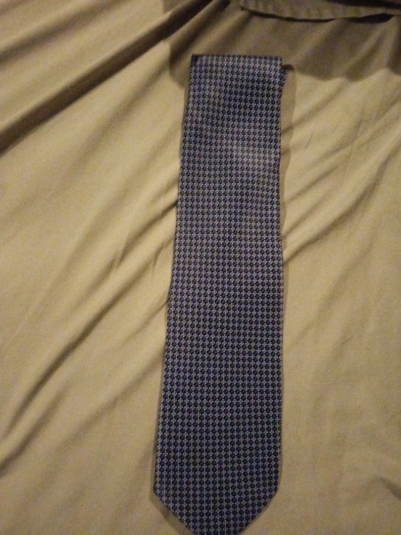 Assorted Patterned Ties (Category: Ties) located in Bukit Baharu. Submitted by kuhanmy (Listing ID 1430375655, Image 2). Description: Collection of assorted patterned ties. Includes ties with various designs such as a navy blue tie with a repeating pattern, a red tie, and a dark brown tie. The ties come in different colors and patterns, suitable for various occasions. Perfect for adding a touch of style to your outfit. *please note price is for e
