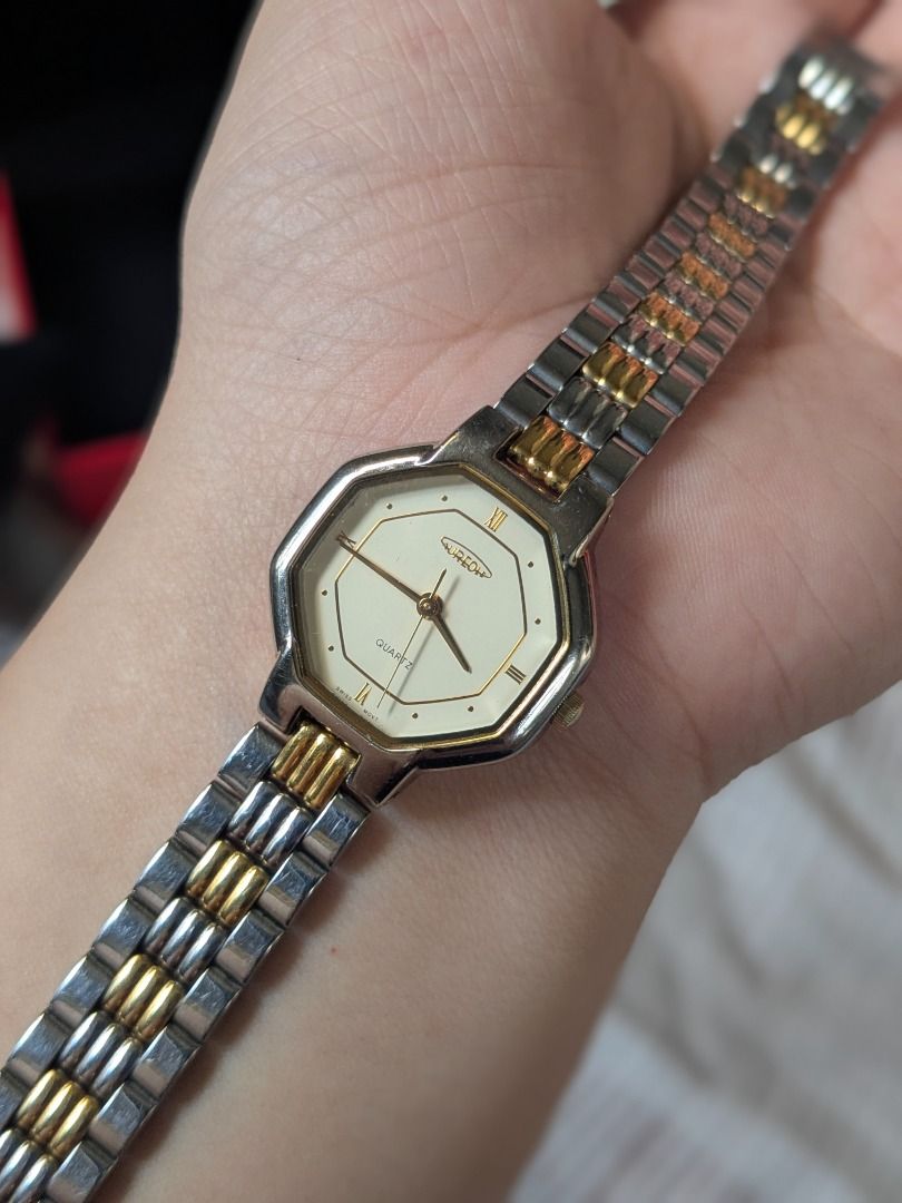 Aureole Octagonal Two Tone Swiss Watch (Category: Women's Watches) located in Quezon City. Submitted by nnncorner (Listing ID 1430382610, Image 2). Description: Original Aureole Octagonal Two Tone Watch 100% original Quartz Swiss Movement Roman Numeral White Dial Collection and Rare Item Got it from Japan No tarnishing on gold and silver No hairlines nor scratches on glass face Fits 17-18 cm wrist only Super pretty in person With replacement box 