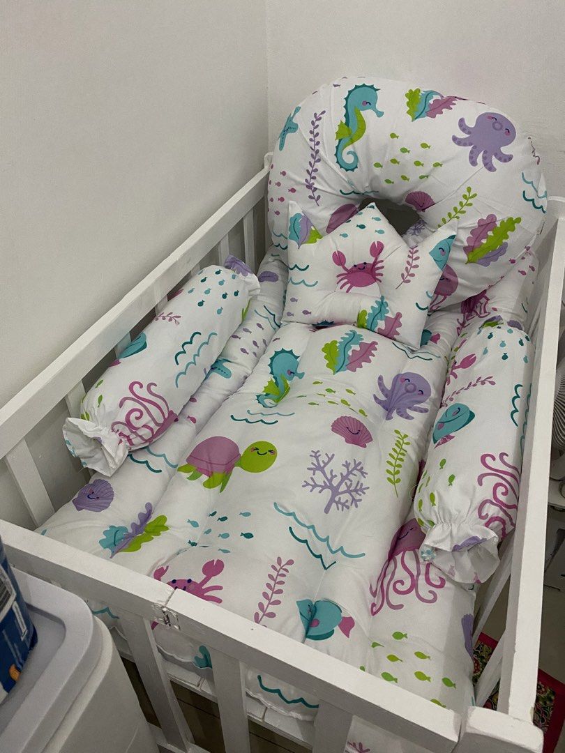 Baby Crib Set with Sea Creature Design (Category: Cots & Cribs) located in Las Pinas. Submitted by beautiqbya (Listing ID 1430342067, Image 1). Description: White wooden crib crib and bed comforter only. pillows are not included..