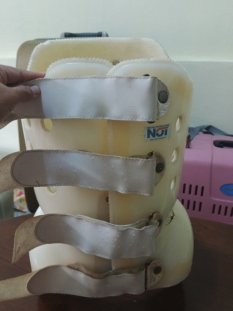 Back Brace with Straps (Category: Braces, Support & Protection) located in Caloocan City. Submitted by surplusandbnewshop (Listing ID 1430275233, Image 3). Description: Back brace with multiple straps and a perforated design. Features a curved shape for support and comfort. Includes adjustable straps for a secure fit. The brace has a beige color. The brand name "NOT" is visible on the brace..
