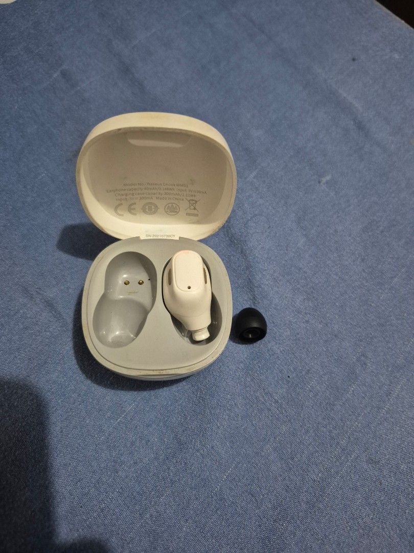 Baseus WM01 earbuds (Category: Earphones) located in Caloocan City. Submitted by r.aconnel (Listing ID 1430321391, Image 1). Description: Missing the other piece. the right side was replaced with another silicone aswell. Otherwise good condition.