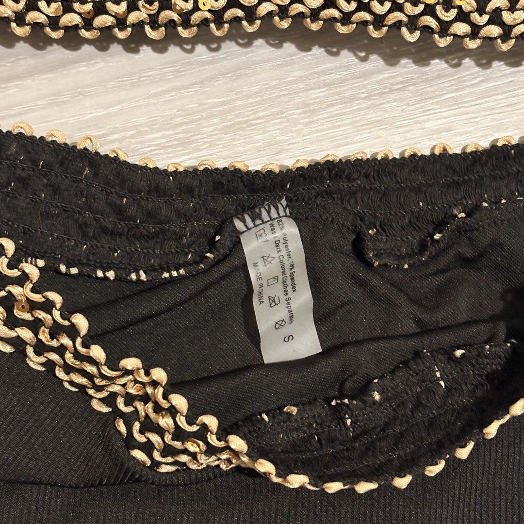 Black Bikini Set with Gold Detailing - Size S (Category: Bikinis & Swimsuits) located in Tarlac. Submitted by shantirisque (Listing ID 1430257935, Image 3). Description: Black bikini set with pads features a bandeau top and high-waisted bottoms. The edges of both pieces are adorned with a gold, textured trim. The set is a size small, as indicated on the label. This two-piece swimsuit is perfect for the beach or pool..