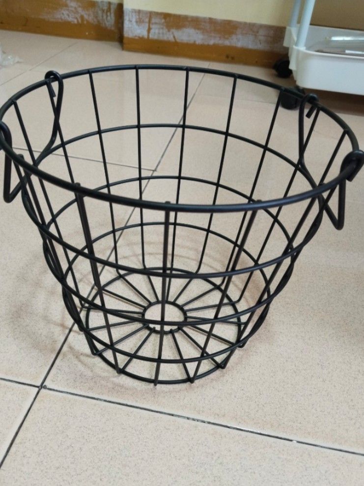 Black Metal Wire Basket (Category: Storage Boxes & Baskets) located in Manila. Submitted by ashenclyde0606 (Listing ID 1430244381, Image 1). Description: - Black metal wire basket - Sturdy construction - Circular base with flared top - Features handles for easy carrying - Open design for ventilation and visibility - Ideal for organizing items.