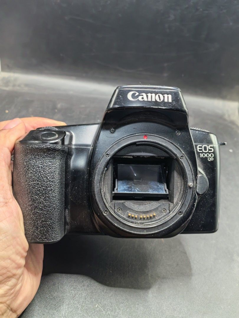 Canon EOS 1000 QD (Category: Cameras) located in Cebu City. Submitted by dudes_villanueva (Listing ID 1430217146, Image 2). Description: Canon EOS 1000 QD (also known as the EOS Rebel II QD in North America) - 1990s. Unit 2 - With Issue Note: Function but with issue. All sales final and non-refundable. Battery not included for testing and demo only Issue: Badly Damaged Curtain For Restoration, collection, or parts. 📌 Type: 35mm autofocus single-